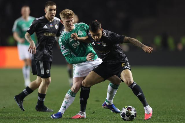Newcastle United's English midfielder #20 Lewis Hall and Qarabag's Brazilian defender #02 Matheus Silva vie for the ball during the UEFA Champions League knockout phase play-off first leg football match between Qarabag and Newcastle at the Tofiq Bahramov Republican Stadium in Baku on February 18, 2026. (Photo by Giorgi ARJEVANIDZE / AFP)