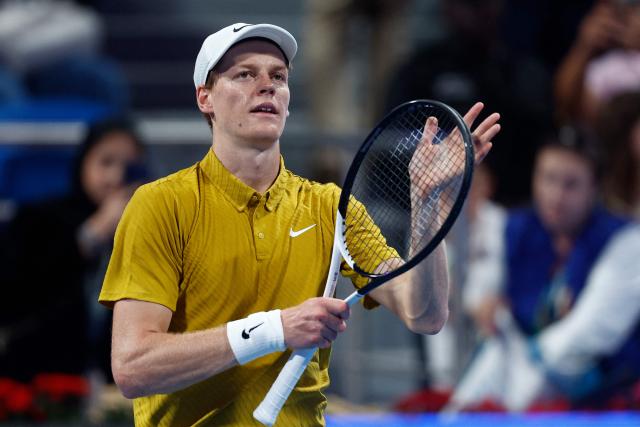 Italy's Jannik Sinner greets the fans after defeating Australia's Alexei Popyrin in their men’s singles match at the Qatar Open tennis tournament in Doha on February 18, 2026. (Photo by Karim JAAFAR / AFP)