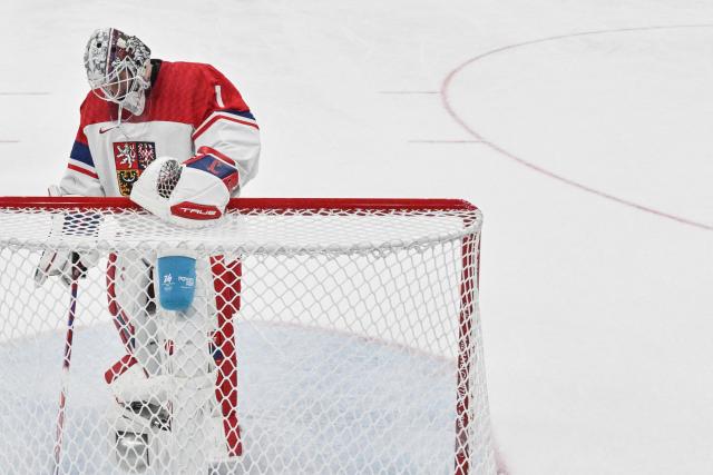 Czech Republic's goalkeeper #01 Lukas Dostal reacts after missing to stop Canada's third goal scored by Canada's #10 Nick Suzuki during the men's play-off quarter-final ice hockey match between Canada and Czech Republic at the Milano Santagiulia Ice Hockey Arena during the Milano Cortina 2026 Winter Olympic Games in Milan, on February 18, 2026. (Photo by Alexander NEMENOV / POOL / AFP)
