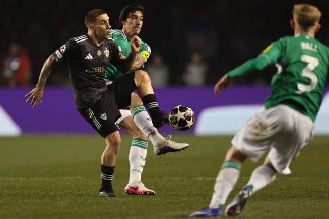 Qarabag's Spanish midfielder #09 Jonatan Montiel Caballero and Newcastle United's Italian midfielder #08 Sandro Tonali vie for the ball during the UEFA Champions League knockout phase play-off first leg football match between Qarabag and Newcastle at the Tofiq Bahramov Republican Stadium in Baku on February 18, 2026. (Photo by Giorgi ARJEVANIDZE / AFP)