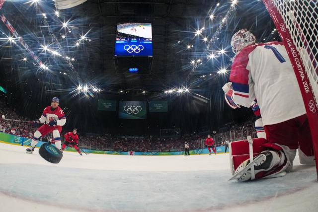 Czech Republic's goalkeeper #01 Lukas Dostal gives up a goal to Canada's #93 Mitch Marner (not pictured) during the men's play-off quarter-final ice hockey match between Canada and Czech Republic at the Milano Santagiulia Ice Hockey Arena during the Milano Cortina 2026 Winter Olympic Games in Milan, on February 18, 2026. (Photo by POOL / AFP)