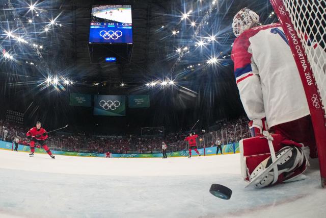 Czech Republic's goalkeeper #01 Lukas Dostal gives up a goal to Canada's #93 Mitch Marner (not pictured) during the men's play-off quarter-final ice hockey match between Canada and Czech Republic at the Milano Santagiulia Ice Hockey Arena during the Milano Cortina 2026 Winter Olympic Games in Milan, on February 18, 2026. (Photo by POOL / AFP)
