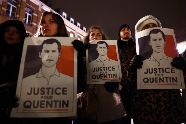 Demonstrators hold portraits during a rally in tribute of Quentin Deranque in Lille, northern France, on February 18, 2026, following his death on the sidelines of a far-right protest against a left-wing politician speaking at a university in the southeastern city of Lyon. (Photo by Sameer AL-DOUMY / AFP)