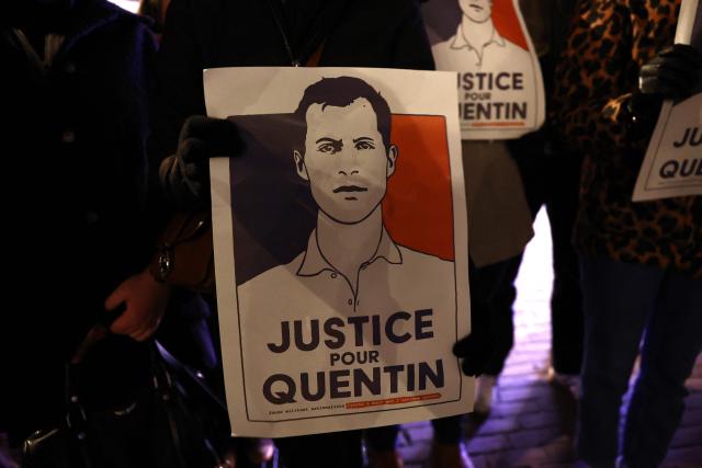 A demonstrator holds a portrait during a rally in tribute of Quentin Deranque in Lille, northern France, on February 18, 2026, following his death on the sidelines of a far-right protest against a left-wing politician speaking at a university in the southeastern city of Lyon. (Photo by Sameer AL-DOUMY / AFP)