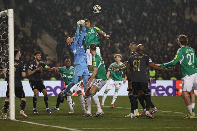 Qarabag's Polish goalkeeper #99 Mateusz Kochalski and Newcastle United's German defender #12 Malick Thiaw vie for the ball during the UEFA Champions League knockout phase play-off first leg football match between Qarabag and Newcastle at the Tofiq Bahramov Republican Stadium in Baku on February 18, 2026. (Photo by Giorgi ARJEVANIDZE / AFP)