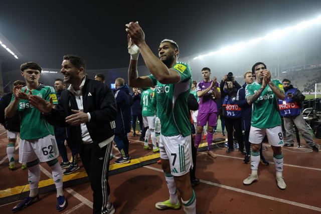 Newcastle United's players celebrate after the UEFA Champions League knockout phase play-off first leg football match between Qarabag and Newcastle at the Tofiq Bahramov Republican Stadium in Baku on February 18, 2026. (Photo by Giorgi ARJEVANIDZE / AFP)