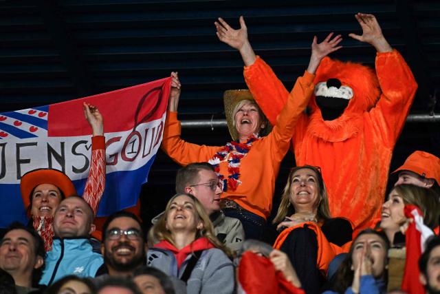 Netherlands fans cheer before the short track speed skating men's 500m semi-final 1 during the Milano Cortina 2026 Winter Olympic Games at Milano Ice Skating Arena in Milan on February 18, 2026. (Photo by Gabriel BOUYS / AFP)
