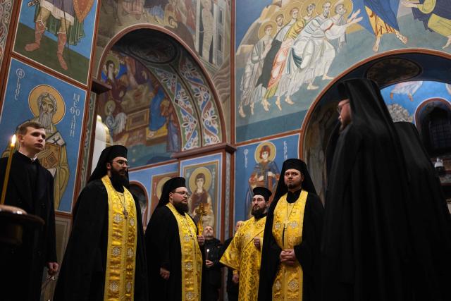 People attend a Day of the Heavenly Heroes memorial service at the St. Michael’s Golden-Domed Cathedral, honouring those killed during the mass Euromaidan protests Verkhovna Rada of Ukraine on February 18, 2014 in Kyiv on February 18, 2026, amid the Russian invasion of Ukraine. (Photo by HENRY NICHOLLS / AFP)