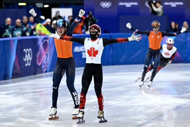 Canada's Steven Dubois celebrates after competing for gold in the short track speed skating men's 500m final during the Milano Cortina 2026 Winter Olympic Games at Milano Ice Skating Arena in Milan on February 18, 2026. (Photo by WANG Zhao / AFP)