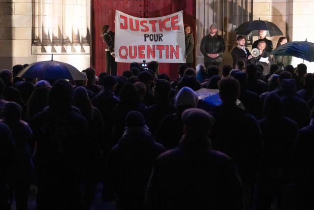 People take part in a tribute ceremony during a rally in support of far-right sympathiser Quentin Debranque, in Nantes, western France, on February 18, 2026. Quentin Deranque, 23, died after sustaining a severe brain injury when he was attacked by at least six people last week on the sidelines of a far-right protest against a left-wing politician speaking at a university in the southeastern city of Lyon. (Photo by Sebastien Salom-Gomis / AFP)