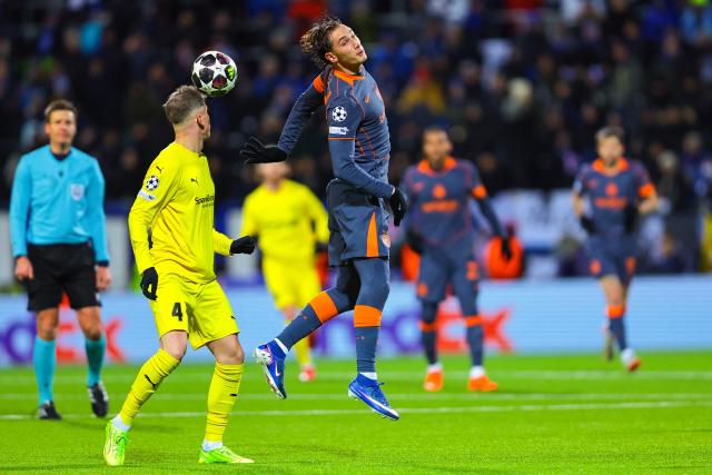 Bodo/Glimt's Norwegian defender #04 Odin Bjortuft and Inter Milan's Italian forward #94 Pio Esposito (R) vie for the ball during the UEFA Champions League first-leg, play-off football match  Bodo/Glimt vs Inter Milan at Aspmyra statium in Bodo, Norway on February 18, 2026. (Photo by Thomas Andersen / NTB / AFP) / Norway OUT