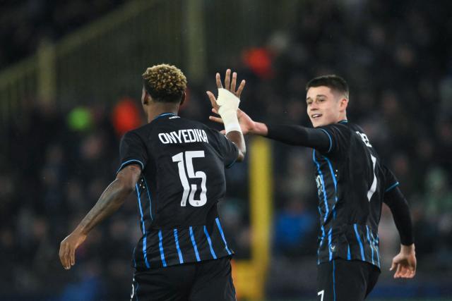 Club Brugge's Nigerian midfielder #15 Raphael Onyedika celebrates scoring his team's first goal during the UEFA Champions League knockout round play-off first leg football match between Club Brugge and Atletico Madrid at the Jan Breydel Stadium in Brugge on February 18, 2026. (Photo by NICOLAS TUCAT / AFP)