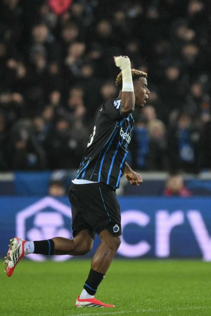 Club Brugge's Nigerian midfielder #15 Raphael Onyedika celebrates scoring his team's first goal during the UEFA Champions League knockout round play-off first leg football match between Club Brugge and Atletico Madrid at the Jan Breydel Stadium in Brugge on February 18, 2026. (Photo by NICOLAS TUCAT / AFP)