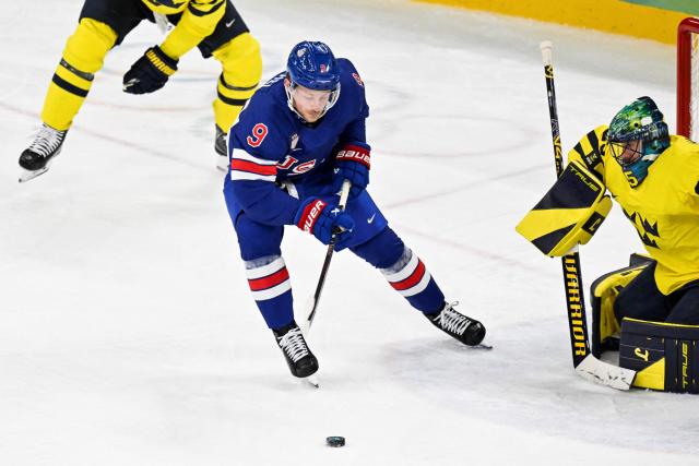 USA's #09 Jack Eichel controls the puck during the men's play-off quarter-final ice hockey match between USA and Sweden at the Milano Santagiulia Ice Hockey Arena during the Milano Cortina 2026 Winter Olympic Games in Milan, on February 18, 2026. (Photo by Alexander NEMENOV / AFP)
