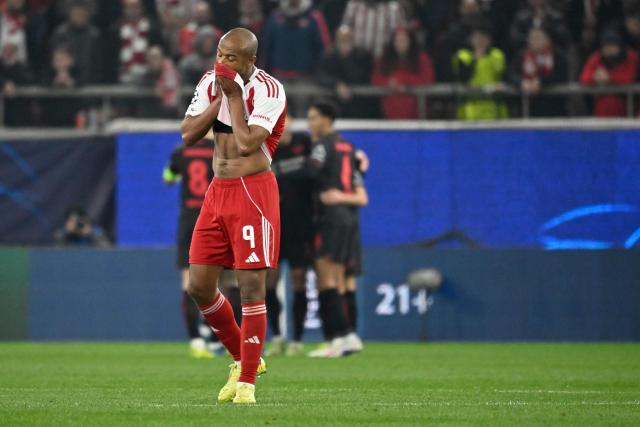 Olympiakos' Moroccan forward #09 Ayoub Kaabi (L) reacts after Olympiakos concede Leverkusen's first goal during the UEFA Champions League knockout round play-off first leg football match between Olympiacos FC (GRE) and Bayer Leverkusen (GER) at the Karaiskakis Stadium in Piraeus, near Athens, on February 18, 2026. (Photo by Aris MESSINIS / AFP)