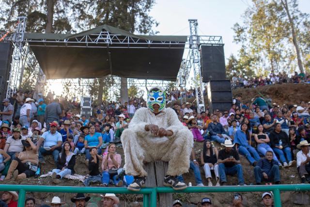A costumed person takes part in the Carnival Tuesday celebrations at the bullring in the Purepecha indigenous community of Tzurumutaro in Patzcuaro, Michoacan state, Mexico, on February 17, 2026. (Photo by ENRIQUE CASTRO / AFP)