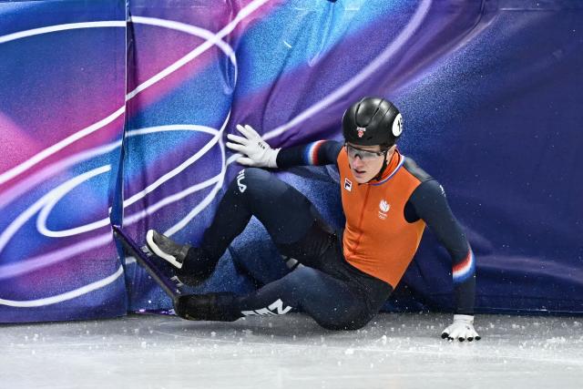 Netherlands' Teun Boer crashes in the short track speed skating men's 500m final during the Milano Cortina 2026 Winter Olympic Games at Milano Ice Skating Arena in Milan on February 18, 2026. (Photo by Gabriel BOUYS / AFP)