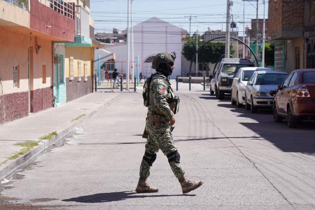 A Mexican Army soldier patrols a street a day after an armed attack on a playground in San Francisco del Rincon, Guanajuato state, Mexico on February 18, 2026. An armed attack in the state of Guanajuato, in central Mexico, left a 36-year-old man dead and at least eight youths injured on a playground on February 17, 2026, another violent episode in the region that provoked terror among local neighbors. (Photo by MARIO ARMAS / AFP)