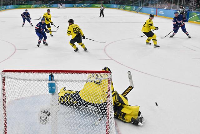 Sweden's #25 Jacob Markstrom makes a save during the men's play-off quarter-final ice hockey match between USA and Sweden at the Milano Santagiulia Ice Hockey Arena during the Milano Cortina 2026 Winter Olympic Games in Milan, on February 18, 2026. (Photo by Alexander NEMENOV / POOL / AFP)