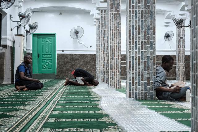 Muslim worshippers perform the evening prayer on the first day of the holy month of Ramadan at the Nadwat Global Assembly Mosque in Lagos Island on February 18, 2026. (Photo by Oyewole Lawal / AFP)