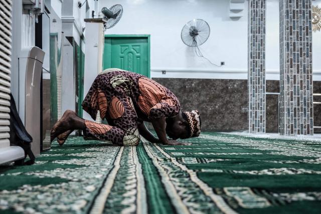 A Muslim worshipper performs the evening prayer on the first day of the holy month of Ramadan at the Nadwat Global Assembly Mosque in Lagos Island on February 18, 2026. (Photo by Oyewole Lawal / AFP)