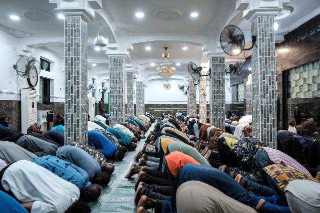 Muslim worshippers perform the evening prayer on the first day of the holy month of Ramadan at the Nadwat Global Assembly Mosque in Lagos Island on February 18, 2026. (Photo by Oyewole Lawal / AFP)