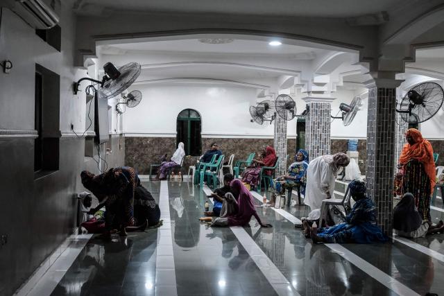 Muslims gather for the first iftar of the holy month of Ramadan at the Nadwat Global Assembly Mosque in Lagos Island on February 18, 2026. (Photo by Oyewole Lawal / AFP)