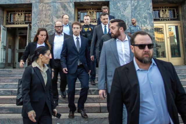 Meta CEO and Chairman Mark Zuckerberg (C) leaves the Los Angeles Superior Court after testifying in the social media trial tasked to determine whether social media giants deliberately designed their platforms to be addictive to children, in Los Angeles, on February 18, 2026. (Photo by Apu GOMES / AFP)