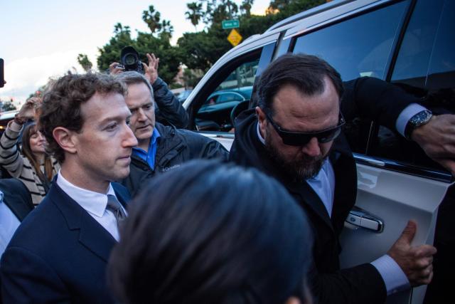 Meta CEO and Chairman Mark Zuckerberg (L) leaves the Los Angeles Superior Court after testifying in the social media trial tasked to determine whether social media giants deliberately designed their platforms to be addictive to children, in Los Angeles, on February 18, 2026. (Photo by Apu GOMES / AFP)
