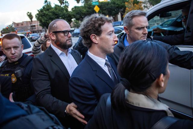 Meta CEO and Chairman Mark Zuckerberg (C) leaves the Los Angeles Superior Court after testifying in the social media trial tasked to determine whether social media giants deliberately designed their platforms to be addictive to children, in Los Angeles, on February 18, 2026. (Photo by Apu GOMES / AFP)