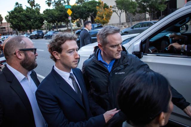 Meta CEO and Chairman Mark Zuckerberg (2-L) leaves the Los Angeles Superior Court after testifying in the social media trial tasked to determine whether social media giants deliberately designed their platforms to be addictive to children, in Los Angeles, on February 18, 2026. (Photo by Apu GOMES / AFP)