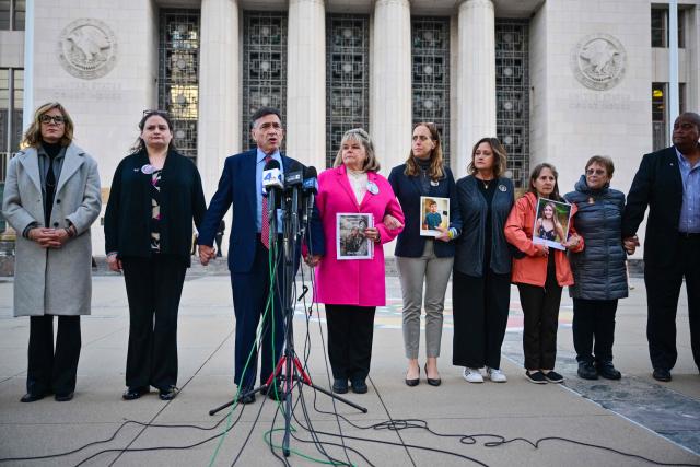 Attorney Matthew Bergman (3-L), founder of the Social Media Victims Law Center and representing the plaintiffs, speaks accompanied by parents and family members outside the Los Angeles Superior Court during the social media trial tasked to determine whether social media giants deliberately designed their platforms to be addictive to children, in Los Angeles, on February 18, 2026. (Photo by Frederic J. Brown / AFP)