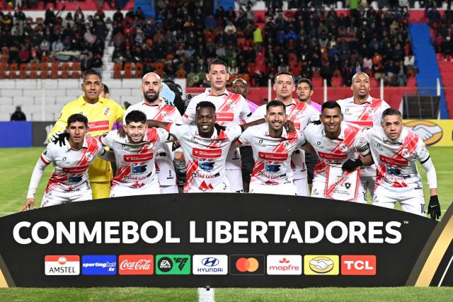 Nacional Potosi's players pose for a team photo ahead of the Copa Libertadores phase two first-leg football match between Bolivia's Nacional Potosi and Brasil's Botafogo at the Victor Agustin Ugarte Stadium in Potosi, Bolivia, on February 18, 2026. (Photo by Aizar RALDES / AFP)