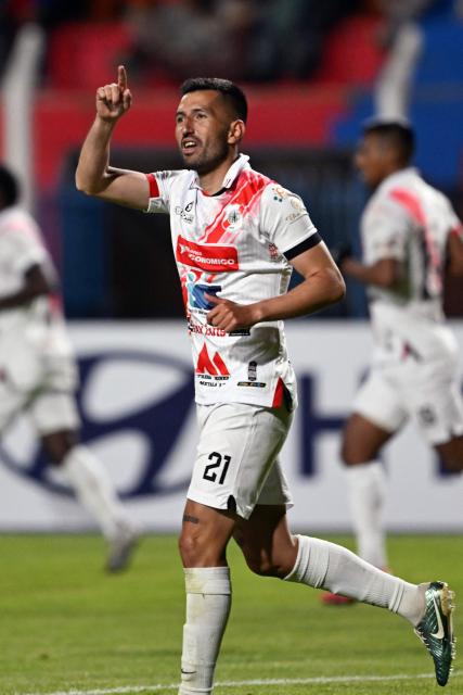 Nacional Potosi's defender #21 Oscar Baldomar celebrates after scoring his team's first goal during the Copa Libertadores phase two first-leg football match between Bolivia's Nacional Potosi and Brasil's Botafogo at the Victor Agustin Ugarte Stadium in Potosi, Bolivia, on February 18, 2026. (Photo by Aizar RALDES / AFP)