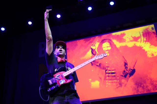 US guitarist and political activist Tom Morello, formerly of Rage Against the Machine band, performs during the campaign kickoff for the California Billionaire Tax Act promoted by US Senator Bernie Sanders at The Wiltern in Los Angeles, February 18, 2026. Sanders is seeking the support of California voters for a November's ballot initiative of an emergency tax on billionaires to help the state's healthcare system. (Photo by Patrick T. Fallon / AFP)