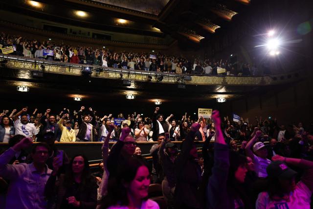 Attendees cheer during the speach of US Senator Bernie Sanders, Independent of Vermont, during the campaign kickoff for the California Billionaire Tax Act at The Wiltern in Los Angeles, February 18, 2026. Sanders is seeking the support of California voters for a November's ballot initiative of an emergency tax on billionaires to help the state's healthcare system. (Photo by Patrick T. Fallon / AFP)