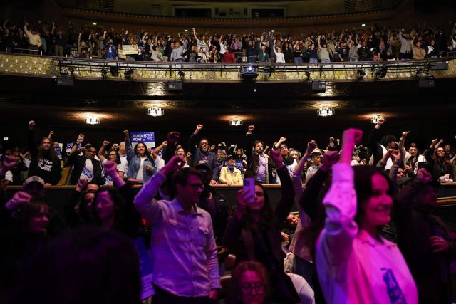 Attendees cheer during the speach of US Senator Bernie Sanders, Independent of Vermont, during the campaign kickoff for the California Billionaire Tax Act at The Wiltern in Los Angeles, February 18, 2026. Sanders is seeking the support of California voters for a November's ballot initiative of an emergency tax on billionaires to help the state's healthcare system. (Photo by Patrick T. Fallon / AFP)