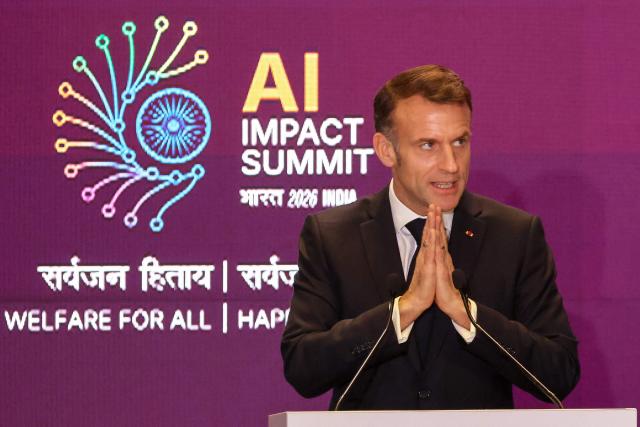 France's President Emmanuel Macron gestures during a speech at the AI Impact Summit in New Delhi on February 19, 2026. (Photo by Ludovic MARIN / AFP)