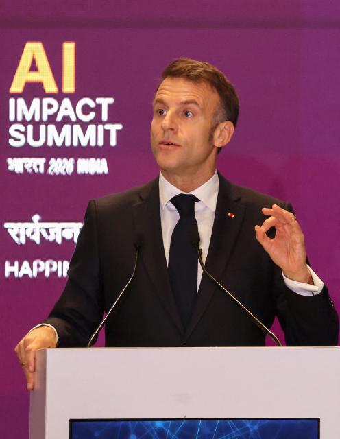 France's President Emmanuel Macron delivers a speech during the AI Impact Summit in New Delhi on February 19, 2026. (Photo by Ludovic MARIN / AFP)