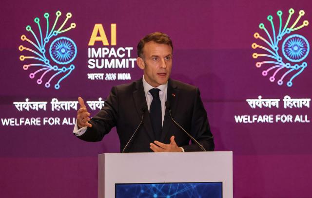 France's President Emmanuel Macron delivers a speech during the AI Impact Summit in New Delhi on February 19, 2026. (Photo by Ludovic MARIN / AFP)