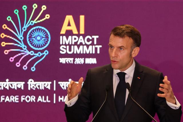 France's President Emmanuel Macron delivers a speech during the AI Impact Summit in New Delhi on February 19, 2026. (Photo by Ludovic MARIN / AFP)