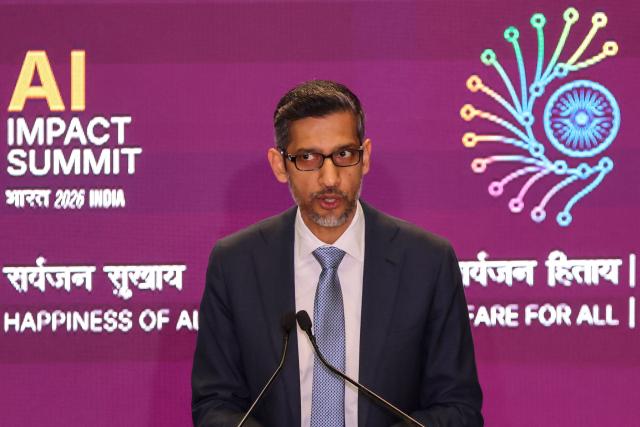 Google CEO Sundar Pichai delivers a speech during the AI Impact Summit in New Delhi on February 19, 2026. (Photo by Ludovic MARIN / AFP)
