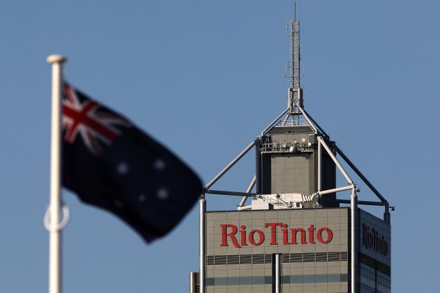 (FILES) This picture taken on September 2, 2025 shows the logo of Rio Tinto, a global mining and metals company, at the headquarters of its iron ore division in Perth, Western Australia. Mining giant Rio Tinto's net profit fell in 2025 as costs climbed and it took a hit from a slump in the Chinese economy, company results showed on February 19, 2026. (Photo by Antony DICKSON / AFP)
