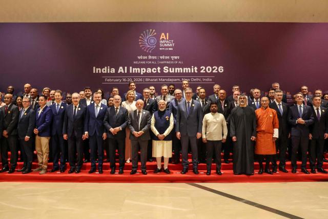 India's Prime Minister Narendra Modi (C) and Brazil's President Luiz Inacio Lula da Silva (centre L) pose with other world leaders and representatives for a group photo during the AI Impact Summit in New Delhi on February 19, 2026. (Photo by Ludovic MARIN / AFP)