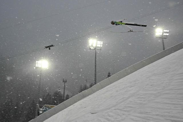 Austria's Johannes Lamparter jumps in the ski jumping trial round of the nordic combined team sprint large hill event at Predazzo Ski Jumping Stadium in Predazzo (Val di Fiemme) during the Milano Cortina 2026 Winter Olympic Games on February 19, 2026. (Photo by Javier SORIANO / AFP)