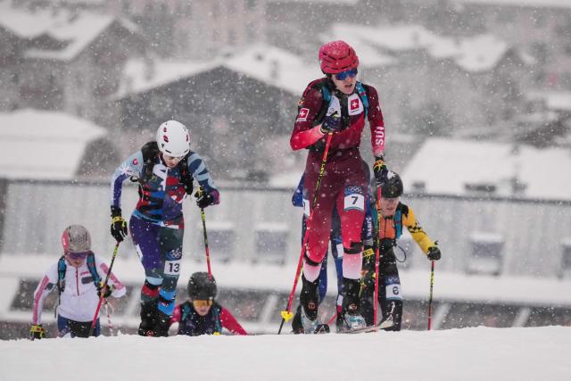 Switzerland's Caroline Ulrich (C) competes in the women's sprint ski mountaineering heat 1 during the Milano Cortina 2026 Winter Olympic Games at the Stelvio Ski Centre in Bormio (Valtellina) on February 19, 2026. (Photo by Dimitar DILKOFF / AFP)