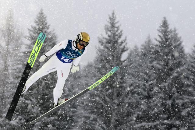 Austria's Johannes Lamparter jumps in the ski jumping competition round of the nordic combined team sprint large hill event at Predazzo Ski Jumping Stadium in Predazzo (Val di Fiemme) during the Milano Cortina 2026 Winter Olympic Games on February 19, 2026. (Photo by Anne-Christine POUJOULAT / AFP)