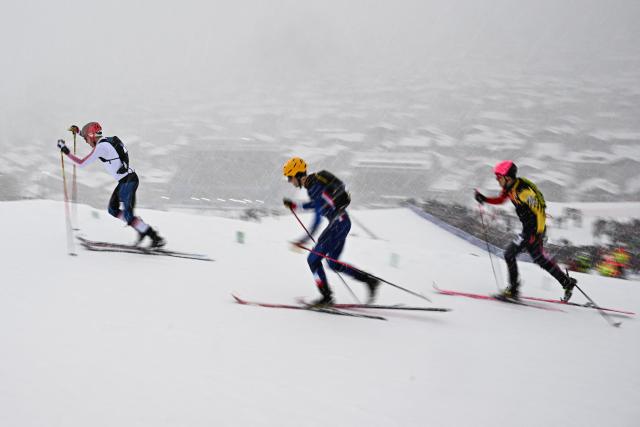 (From L) Norway's Hans-Inge Klette, France's Thibault Anselmet and Germany's Finn Hoesch compete in the men's sprint ski mountaineering heat 3 during the Milano Cortina 2026 Winter Olympic Games at the Stelvio Ski Centre in Bormio (Valtellina) on February 19, 2026. (Photo by Fabrice COFFRINI / AFP)