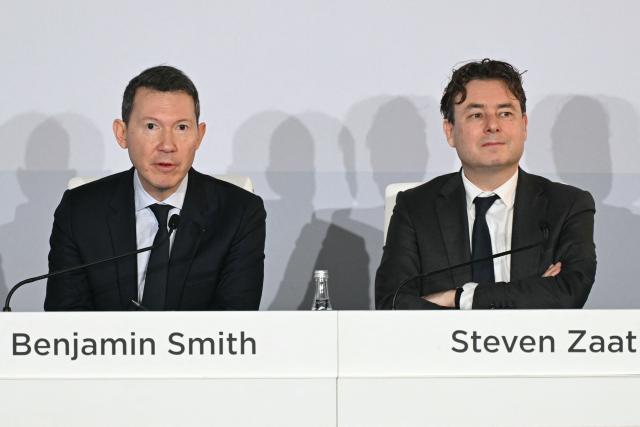 Air France KLM general director Benjamin Smith (L) and Air France KLM chief financial officer Steven Zaat give a press conference to present the annual group's results in Paris on February 19, 2026. Air France-KLM shares soared on February 19, 2026 after the airline posted a full-year net profit of 1.75 billion euros ($2.1 billion), a record for the airline as it focused on premium offerings and benefitted from lower fuel prices. Revenues for the Franco-Dutch carrier rose 4.9 percent to 33 billion euros, also a record, in what it called a "challenging environment", with passenger numbers up five percent to 102.8 million people. (Photo by Bertrand GUAY / AFP)