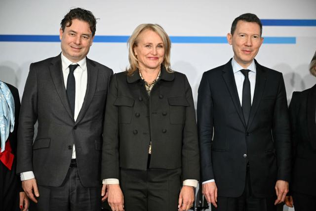 (L to R) Air France KLM chief financial officer Steven Zaat, KLM president and Chief Executive Officer Marjan Rintel and Air France KLM general director Benjamin Smith pose during a press conference to present the annual group's results in Paris on February 19, 2026. Air France-KLM shares soared on February 19, 2026 after the airline posted a full-year net profit of 1.75 billion euros ($2.1 billion), a record for the airline as it focused on premium offerings and benefitted from lower fuel prices. Revenues for the Franco-Dutch carrier rose 4.9 percent to 33 billion euros, also a record, in what it called a "challenging environment", with passenger numbers up five percent to 102.8 million people. (Photo by Bertrand GUAY / AFP)